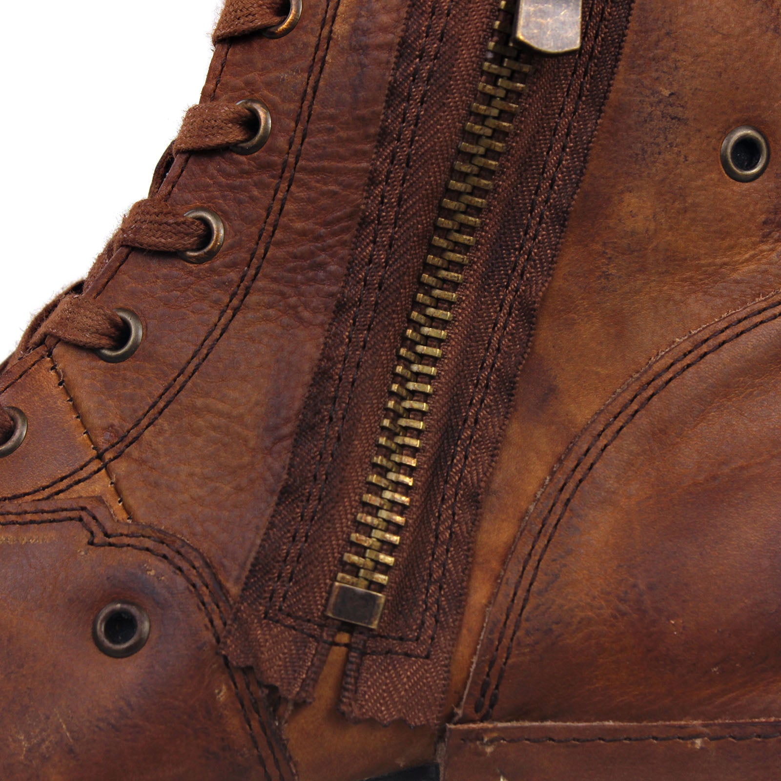 Osstone Close-up of a brown leather boot with a zipper
